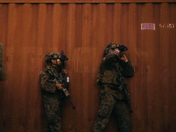 U.S. Marines with 2nd Battalion, 1st Marine Regiment, Marine Rotational Force – Darwin 25.3, take cover during the final event of Predator’s Run at Mount Bundey Training Area, Northern Territory, Australia, June 9, 2025.