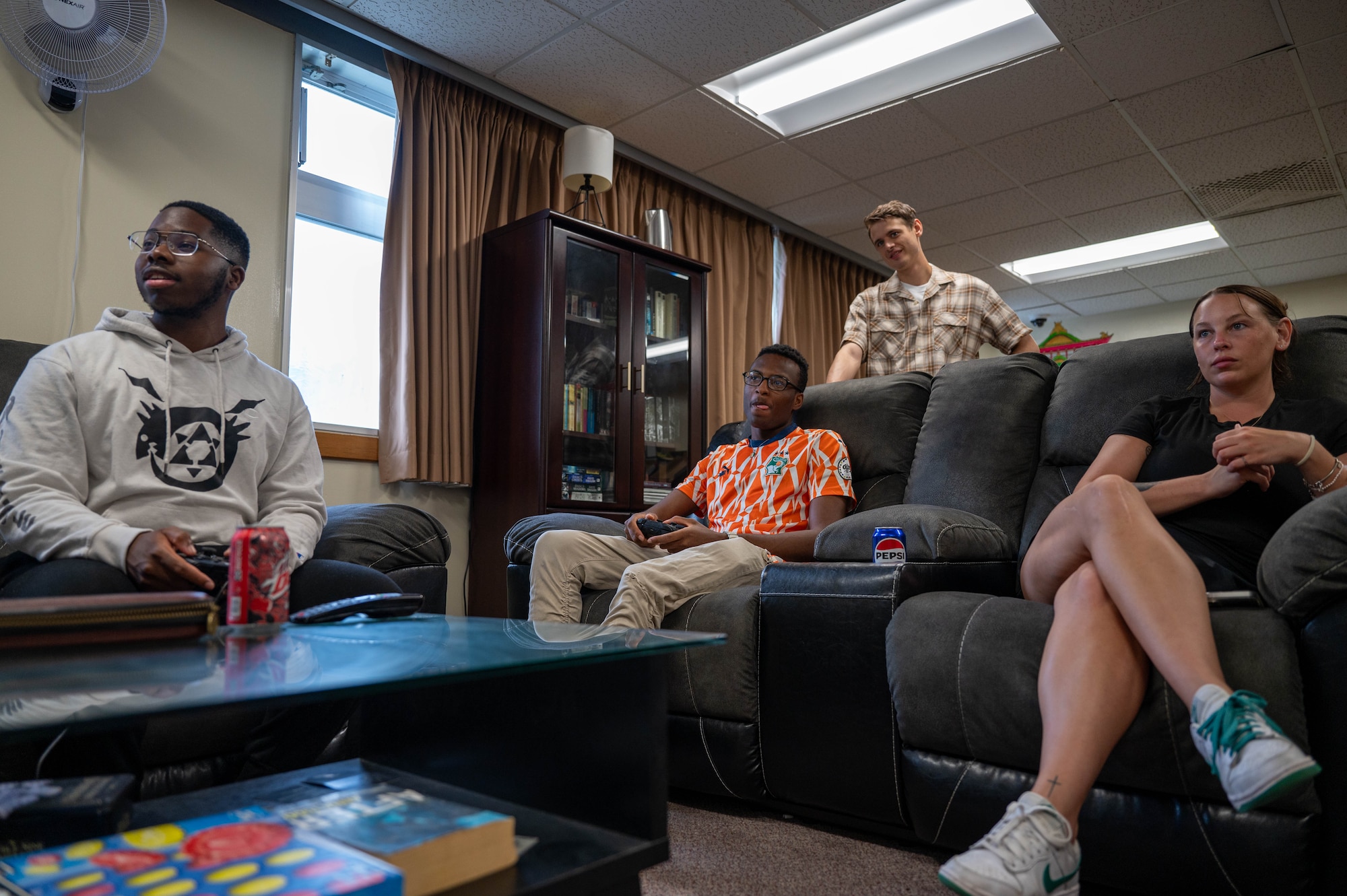 Service members relax in common room after duty day.