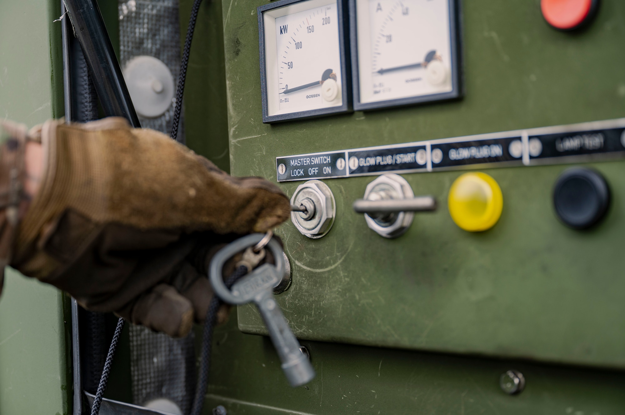 U.S. Army Pfc. Da’Mario Deal-Maddox, 1-1 Air Defense Artillery vehicle driver, inserts a key into an M1097A2 electric power plant assigned to the 1-1 ADA on Kadena Air Base, Japan, July 24, 2025.