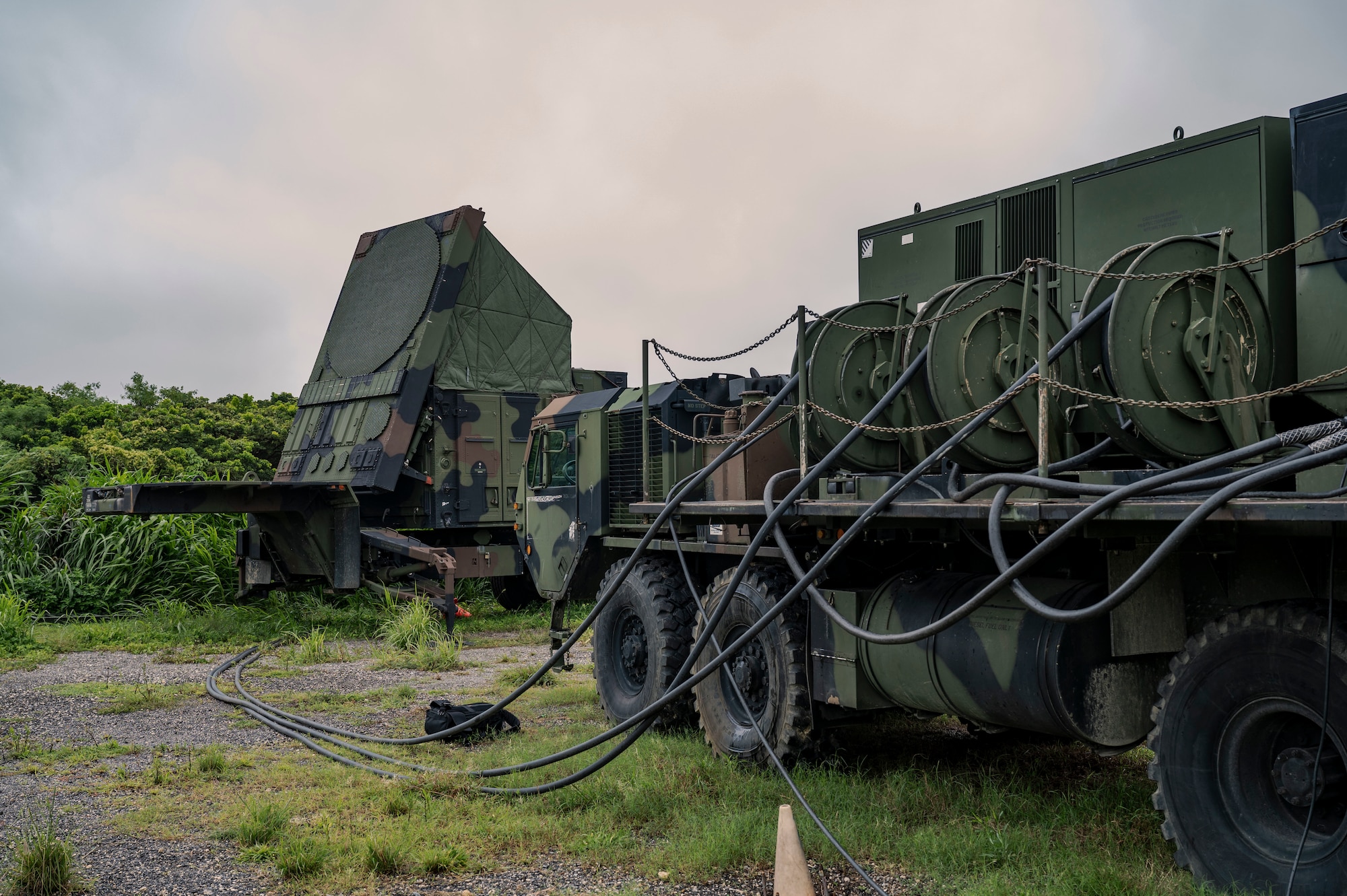 A U.S. Army AN/MPQ-65 radar assigned to the 1-1 Air Defense Artillery, right, receives fuel from an M1097A2 electric power plant on Kadena Air Base, Japan, July 24, 2025.
