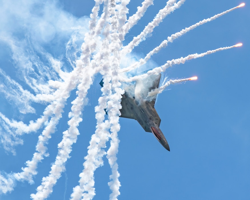 F-22 flying and firing flares