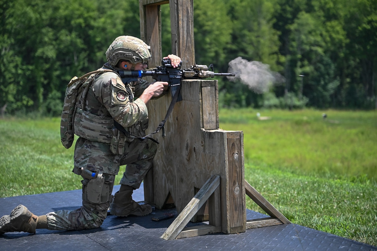Airman 1st Class Christopher Benz, an Integrated Defense Leadership Course student from the 514th Security Forces Squadron at Joint Base McGuire-Dix-Lakehurst, N.J., fires an M4 carbine rifle at Camp James A. Garfield Joint Military Training Center, Ohio, July 15, 2025. The course is a two-week, hands-on training program for Air Force Security Forces Airmen to achieve and maintain combat readiness. (U.S. Air Force photo by Eric M. White)