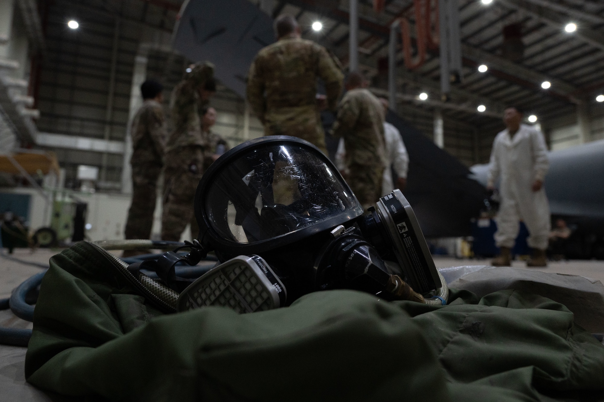 Members of the 379th Expeditionary Civil Engineer Squadron and the 379th Expeditionary Aircraft Maintenance Squadron prepare for a confined-space extraction exercise within the U.S. Central Command area of responsibility, July 21, 2025. The exercise simulated an Airman fainting in a confined space due to fuel vapors. (U.S. Air Force photo by Senior Airman Dieondiere Jefferies)