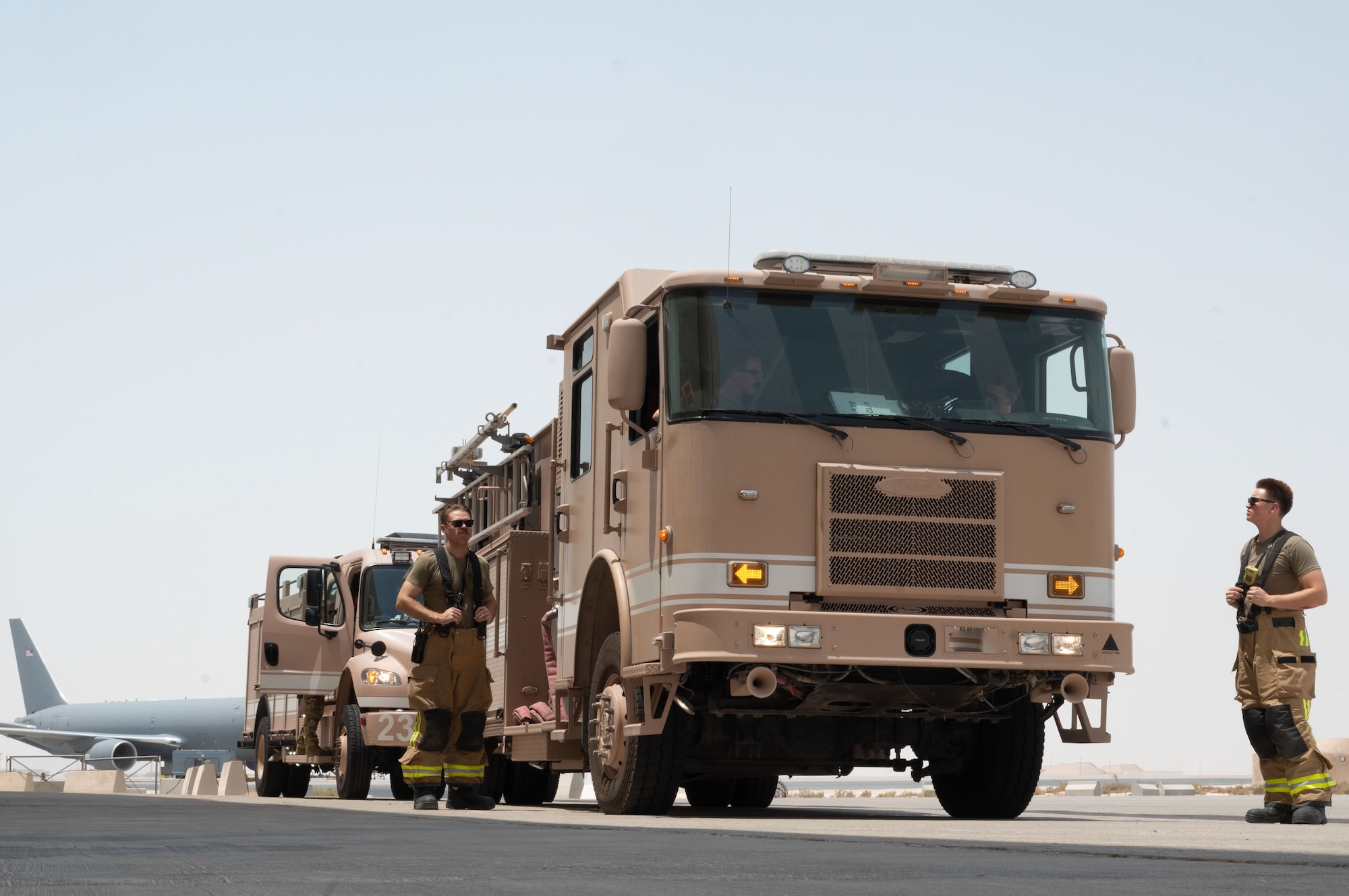 Firefighters assigned to the 379th Expeditionary Civil Engineer Squadron arrive to assist in a simulated confined-space extraction during an exercise within the U.S. Central Command area of responsibility, July 21, 2025. In the event of an accident or emergency, where personnel become trapped inside confined spaces, Airmen must be prepared to conduct rescue operations swiftly and effectively. (U.S. Air Force photo by Senior Airman Dieondiere Jefferies)