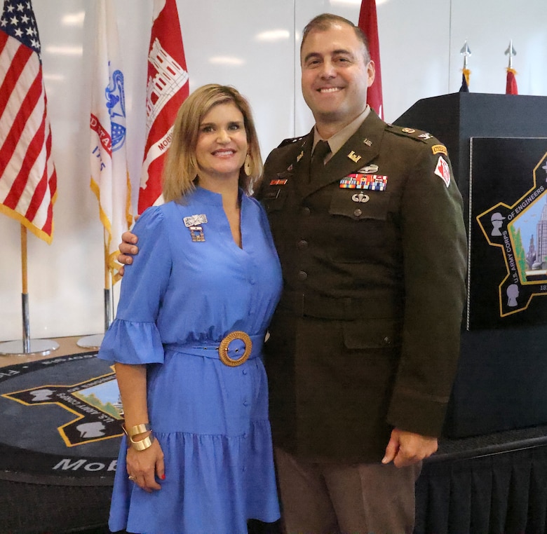 U.S. Army Corps of Engineers, Mobile District commander Col. Jeremy Chapman poses for a photo with his wife Renee Chapman at his retirement ceremony