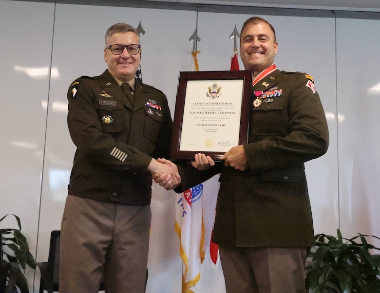 U.S. Army Corps of Engineers, Mobile District commander Col. Jeremy Chapman, right, receives his retirement certificate from Brigadier Gen. Zachary Miller, South Atlantic Division commander