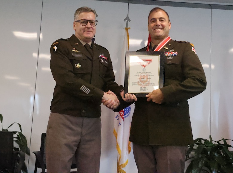 U.S. Army Corps of Engineers, Mobile District commander Col. Jeremy Chapman, right, receives the Silver de Fleury medal from Brigadier Gen. Zachary Miller, South Atlantic Division commander