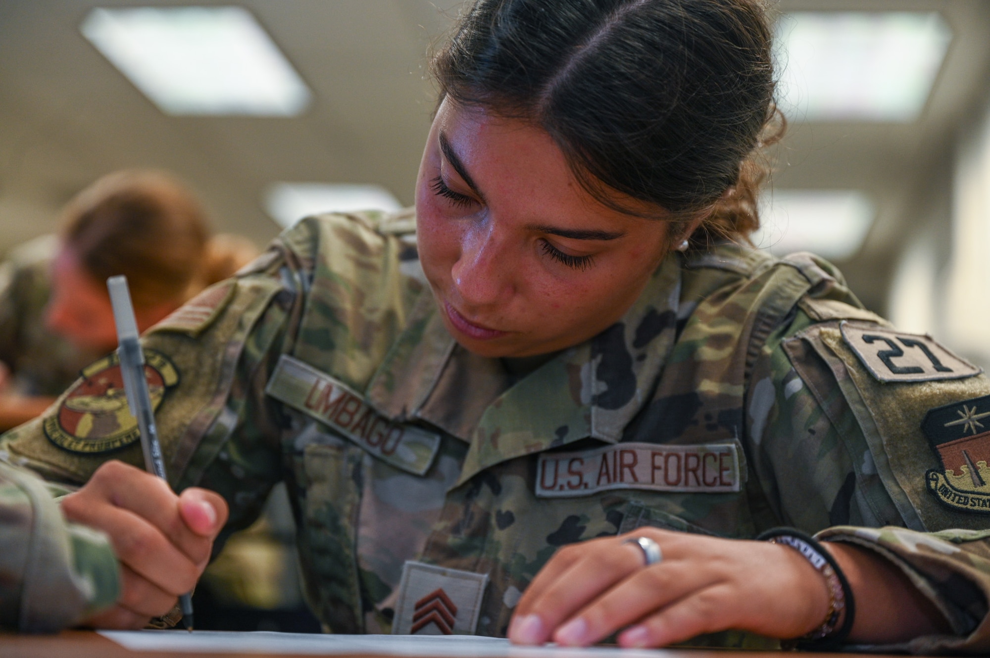 U.S. Air Force Academy Cadet Joselyn Limbago signs a waiver agreeing to be tased for a 11th Security Forces Squadron training exercise during a USAFA Summer Operations visit at Joint Base Anacostia-Bolling, Washington, D.C., July 16, 2025. The training featured both classroom and tactical instruction, which met the summer program’s goal of helping cadets develop a deeper understanding of the Air Force mission requirements across different career fields. (U.S. Air Force photo by Airman 1st Class Shanel Toussaint)