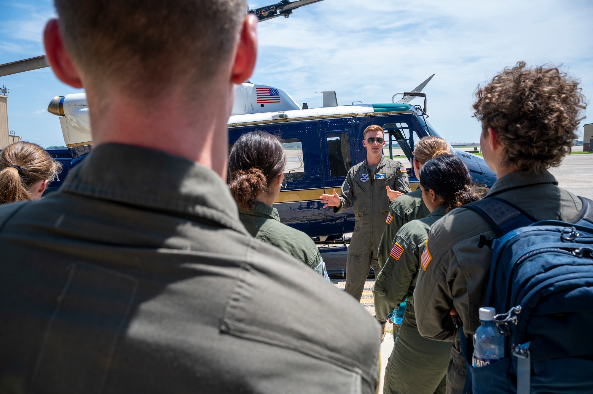 U.S. Air Force Capt. Vance Holub, a pilot with the 1st Helicopter Squadron, conducts a tour of a UH-1N Huey helicopter for cadets from the U.S. Air Force Academy at Joint Base Andrews, Md., July 17, 2025. Cadets visited JBA and Joint Base Anacostia-Bolling, Washington, D.C., as part of USAFA’s Summer Operations program to learn more about officer life and the operational Air Force. (U.S. Air Force photo by Hayden Hallman)