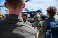 U.S. Air Force Capt. Vance Holub, a pilot with the 1st Helicopter Squadron, conducts a tour of a UH-1N Huey helicopter for cadets from the U.S. Air Force Academy at Joint Base Andrews, Md., July 17, 2025. Cadets visited JBA and Joint Base Anacostia-Bolling, Washington, D.C., as part of USAFA’s Summer Operations program to learn more about officer life and the operational Air Force. (U.S. Air Force photo by Hayden Hallman)