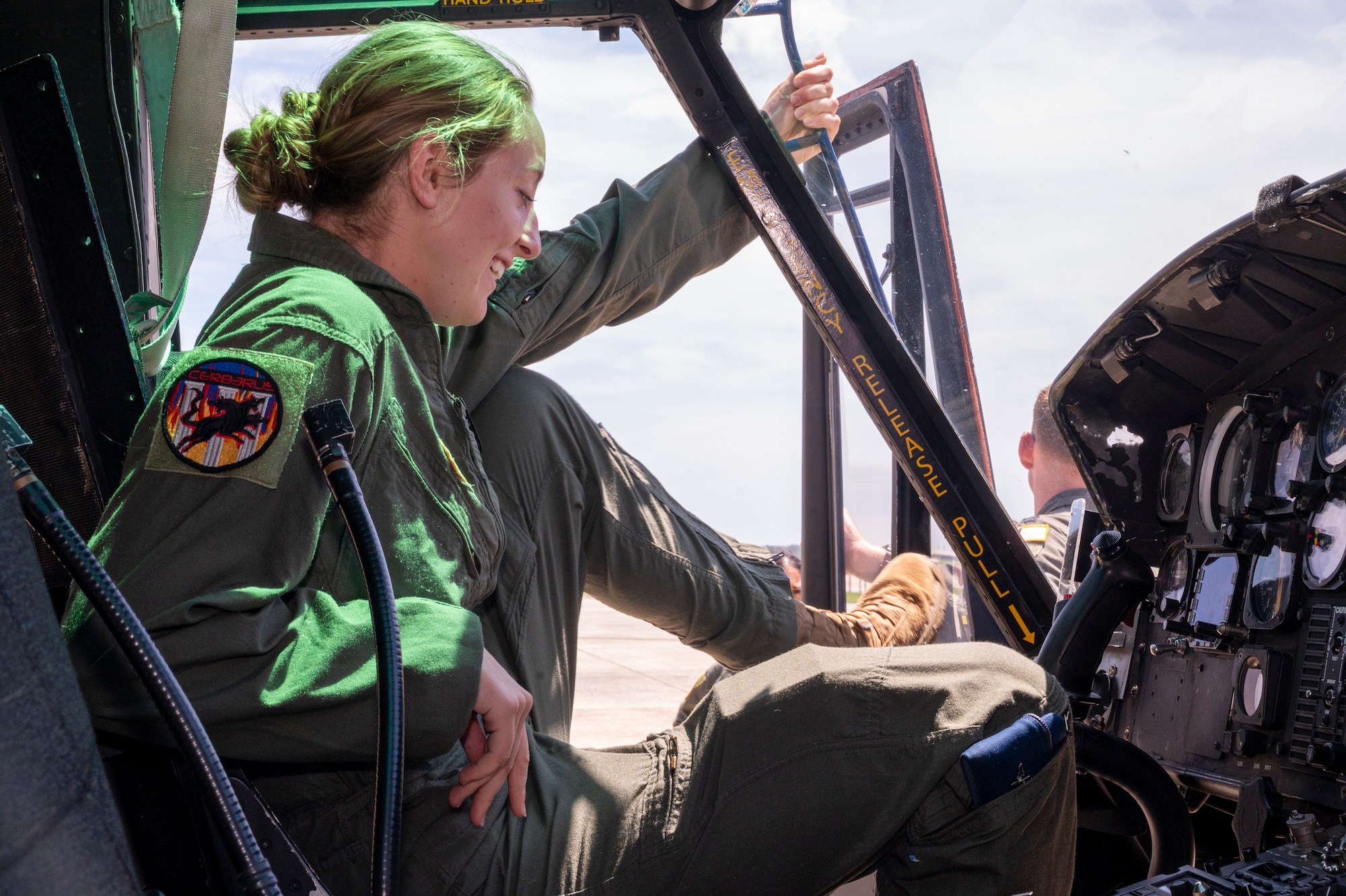 U.S. Air Force Academy Cadet Kate Fleming enters a UH-1N Huey helicopter during a tour of the 1st Helicopter Squadron at Joint Base Andrews, Md., July 17, 2025. Cadets visited JBA and Joint Base Anacostia-Bolling, Washington, D.C., as part of USAFA’s Summer Operations program to learn more about officer life and the operational Air Force. (U.S. Air Force photo by Hayden Hallman)