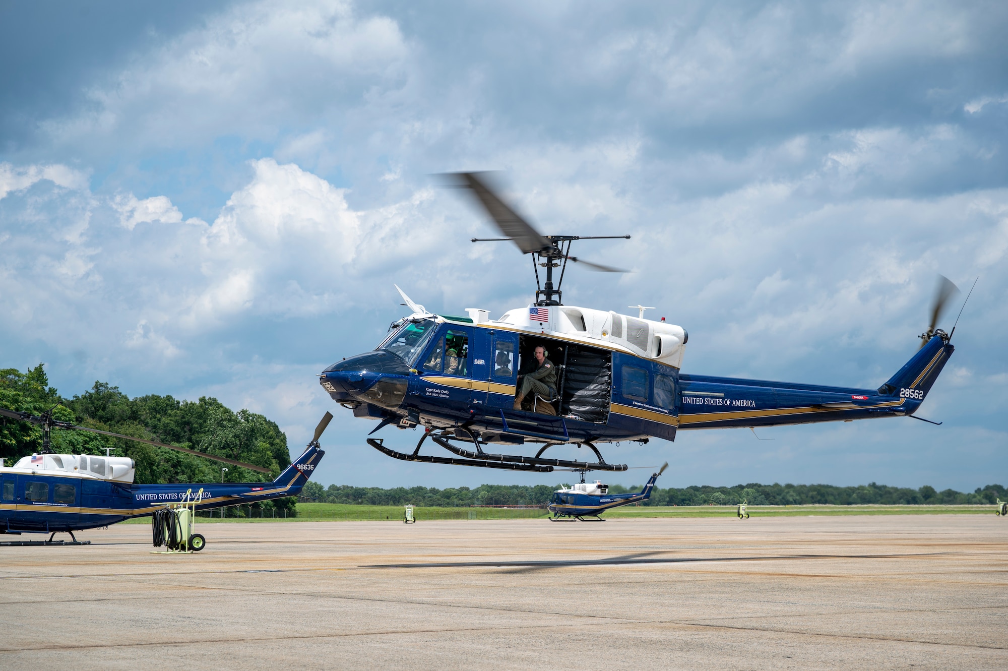 U.S. Air Force Airmen from the 1st Helicopter Squadron and cadets from the U.S. Air Force Academy fly in a UH-1N Huey helicopter during a tour of the 1st HS at Joint Base Andrews, Md., July 17, 2025. Cadets visited JBA and Joint Base Anacostia-Bolling, Washington, D.C., as part of USAFA’s Summer Operations program to learn more about officer life and the operational Air Force. (U.S. Air Force photo by Hayden Hallman)