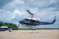 U.S. Air Force Airmen from the 1st Helicopter Squadron and cadets from the U.S. Air Force Academy fly in a UH-1N Huey helicopter during a tour of the 1st HS at Joint Base Andrews, Md., July 17, 2025. Cadets visited JBA and Joint Base Anacostia-Bolling, Washington, D.C., as part of USAFA’s Summer Operations program to learn more about officer life and the operational Air Force. (U.S. Air Force photo by Hayden Hallman)