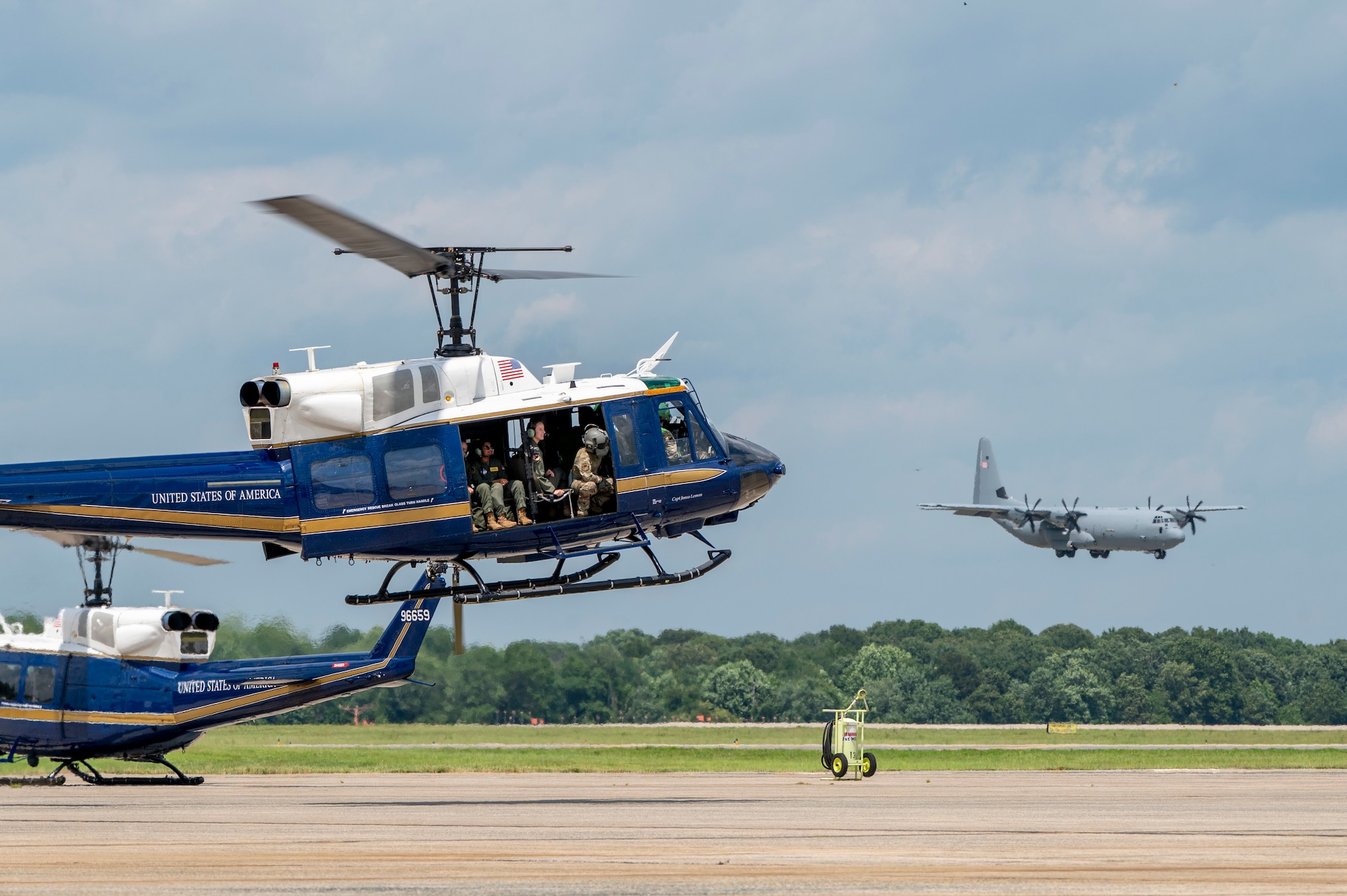U.S. Airmen from the 1st Helicopter Squadron and cadets from the U.S. Air Force Academy fly in a UH-1N Huey helicopter during a tour of the 1st HS at Joint Base Andrews, Md., July 17, 2025. Cadets visited JBA and Joint Base Anacostia-Bolling, Washington, D.C., as part of USAFA’s Summer Operations program to learn more about officer life and the operational Air Force. (U.S. Air Force photo by Hayden Hallman)