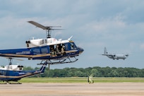 U.S. Airmen from the 1st Helicopter Squadron and cadets from the U.S. Air Force Academy fly in a UH-1N Huey helicopter during a tour of the 1st HS at Joint Base Andrews, Md., July 17, 2025. Cadets visited JBA and Joint Base Anacostia-Bolling, Washington, D.C., as part of USAFA’s Summer Operations program to learn more about officer life and the operational Air Force. (U.S. Air Force photo by Hayden Hallman)