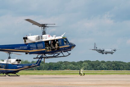U.S. Airmen from the 1st Helicopter Squadron and cadets from the U.S. Air Force Academy fly in a UH-1N Huey helicopter during a tour of the 1st HS at Joint Base Andrews, Md., July 17, 2025. Cadets visited JBA and Joint Base Anacostia-Bolling, Washington, D.C., as part of USAFA’s Summer Operations program to learn more about officer life and the operational Air Force. (U.S. Air Force photo by Hayden Hallman)