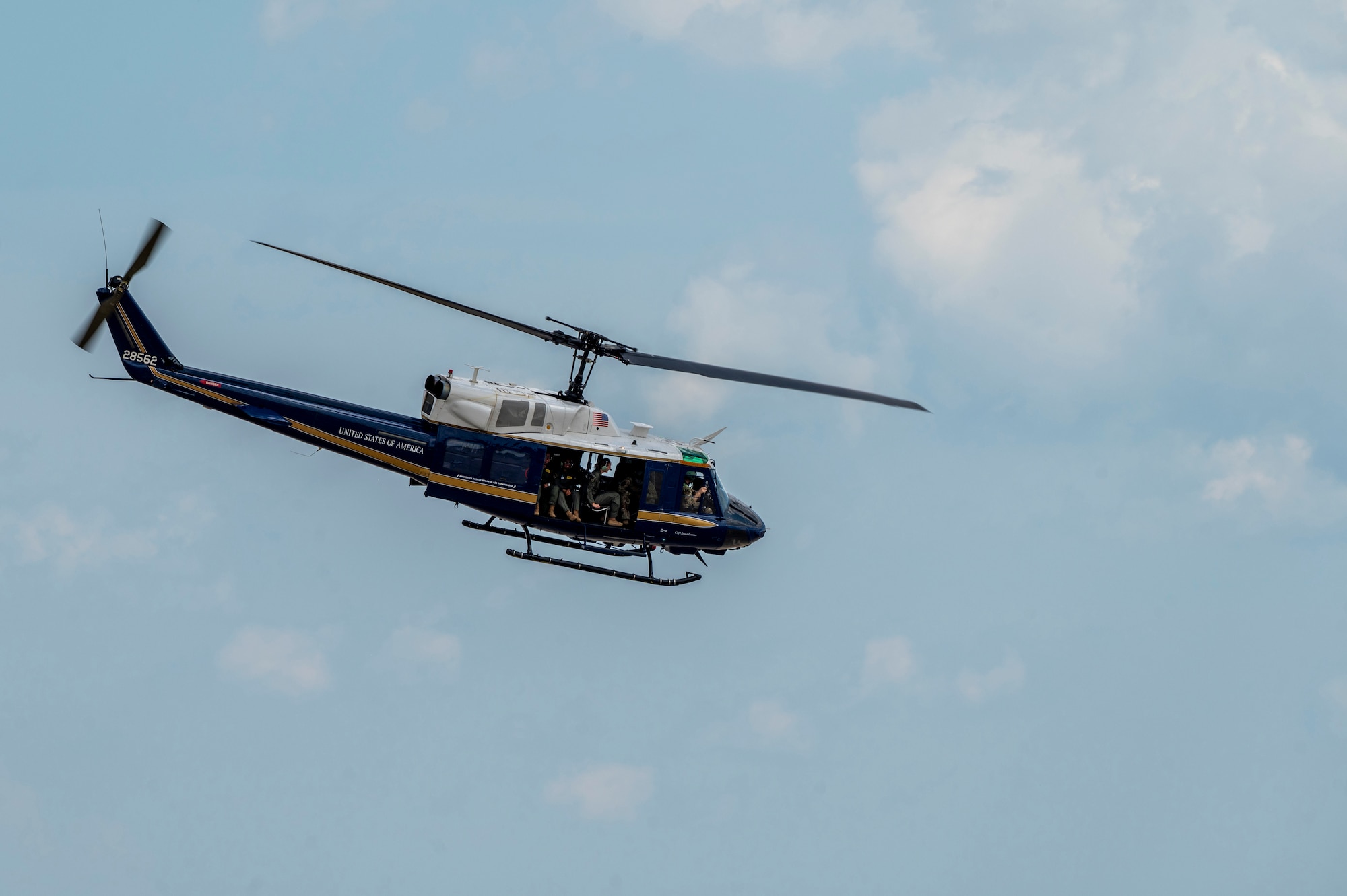 U.S. Airmen from the 1st Helicopter Squadron and cadets from the U.S. Air Force Academy fly in a UH-1N Huey helicopter during a tour of the 1st HS at Joint Base Andrews, Md., July 17, 2025. Cadets visited JBA and Joint Base Anacostia-Bolling, Washington, D.C., as part of USAFA’s Summer Operations program to learn more about officer life and the operational Air Force. (U.S. Air Force photo by Hayden Hallman)
