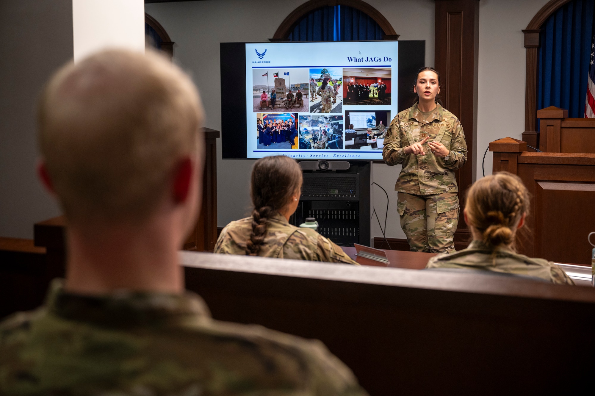 U.S. Air Force Capt. Erin Carnick, judge advocate with the 11th Wing Office of the Staff Judge Advocate, delivers a presentation about Air Force legal operations to cadets from the U.S. Air Force Academy at Joint Base Anacostia-Bolling, Washington, D.C., July 18, 2025. Cadets visited JBAB as part of USAFA’s Summer Operations program to learn more about officer life and the operational Air Force. (U.S. Air Force photo by Hayden Hallman)