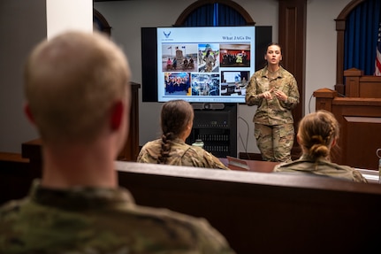 U.S. Air Force Capt. Erin Carnick, judge advocate with the 11th Wing Office of the Staff Judge Advocate, delivers a presentation about Air Force legal operations to cadets from the U.S. Air Force Academy at Joint Base Anacostia-Bolling, Washington, D.C., July 18, 2025. Cadets visited JBAB as part of USAFA’s Summer Operations program to learn more about officer life and the operational Air Force. (U.S. Air Force photo by Hayden Hallman)