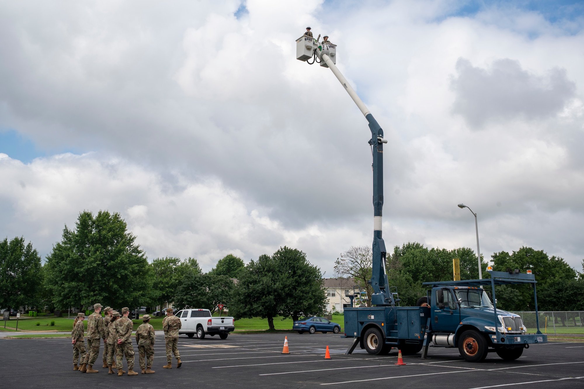 U.S. Air Force Academy cadets participate in a demonstration of an aerial lift truck from the 11th Civil Engineer Squadron at Joint Base Anacostia-Bolling, Washington, D.C., July 15, 2025. Cadets visited JBAB as part of USAFA’s Summer Operations program to learn more about officer life and the operational Air Force. (U.S. Air Force photo by Hayden Hallman)