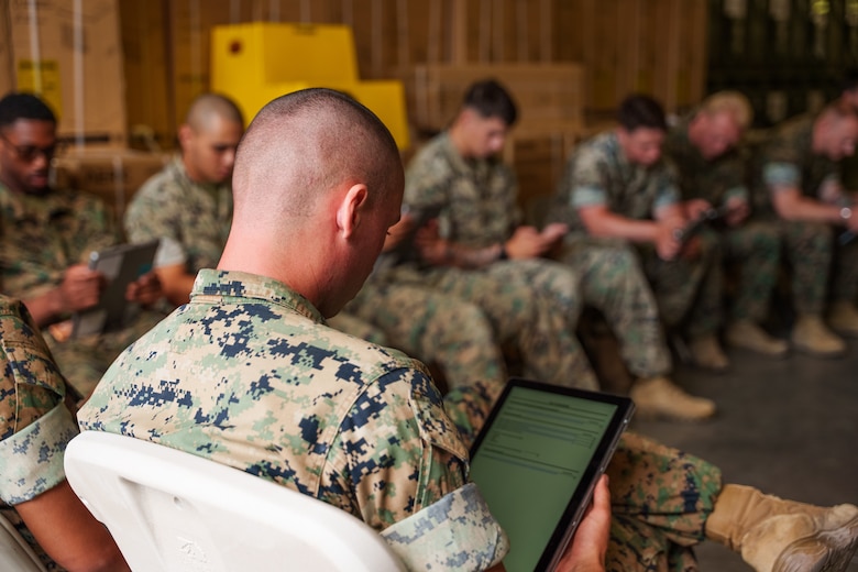 U.S. Marines with 1st Battalion, 5th Marine Regiment, complete electronic surveys during a limited user evaluation of main pack frame systems at Marine Corps Base Camp Pendleton, Calif.