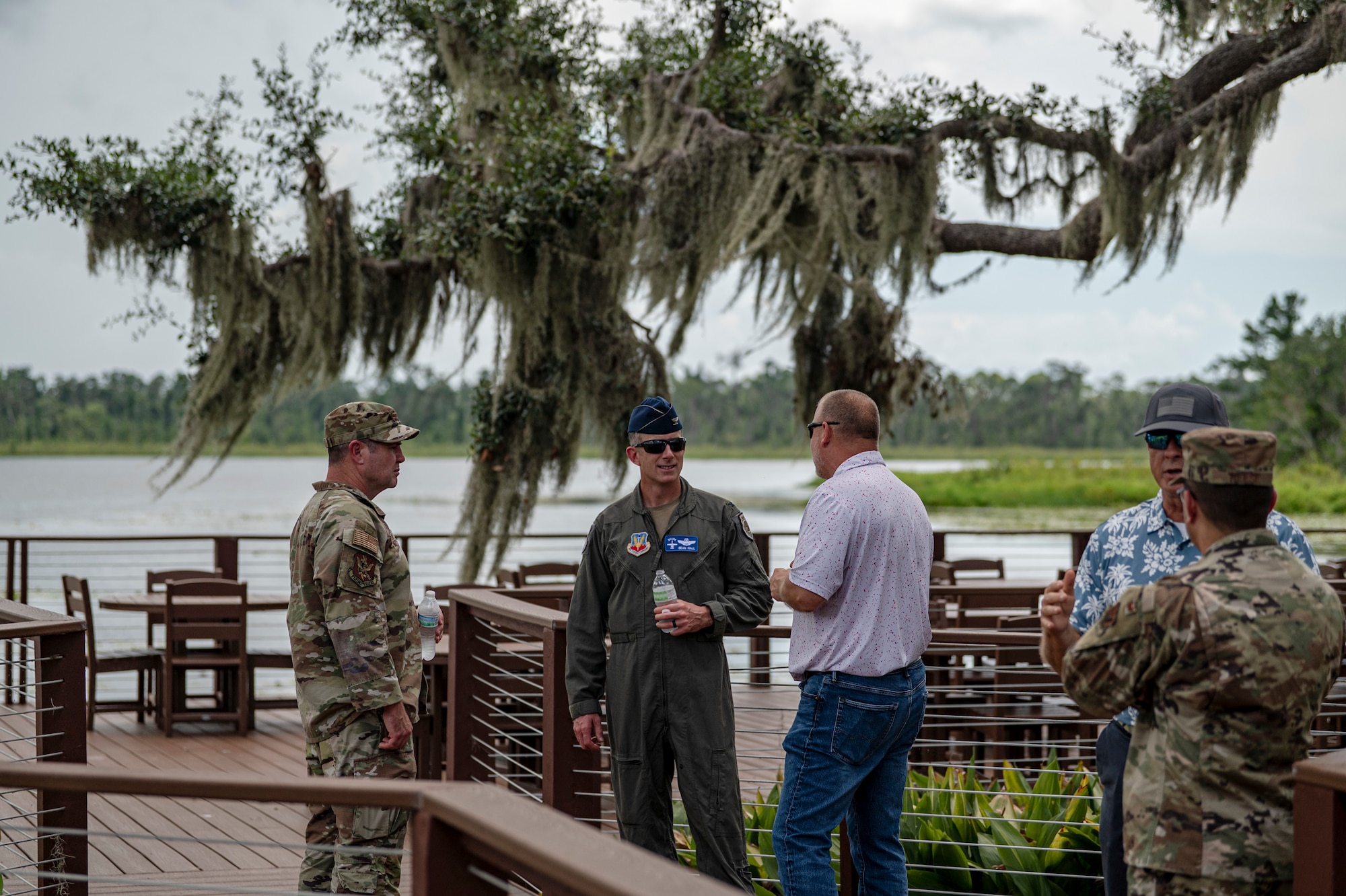 U.S. Air Force Col. Paul Sheets, 23rd Wing commander, left, and Col. Sean Hall, 23rd Wing incoming commander, second from left, receive an update on the progress of the Grassy Pond Recreation Area rebuild in Lake Park, Georgia, July 18, 2025. Wing leadership discussed completed repairs and ongoing construction across the site. (U.S. Air Force photo by Senior Airman Leonid Soubbotine)