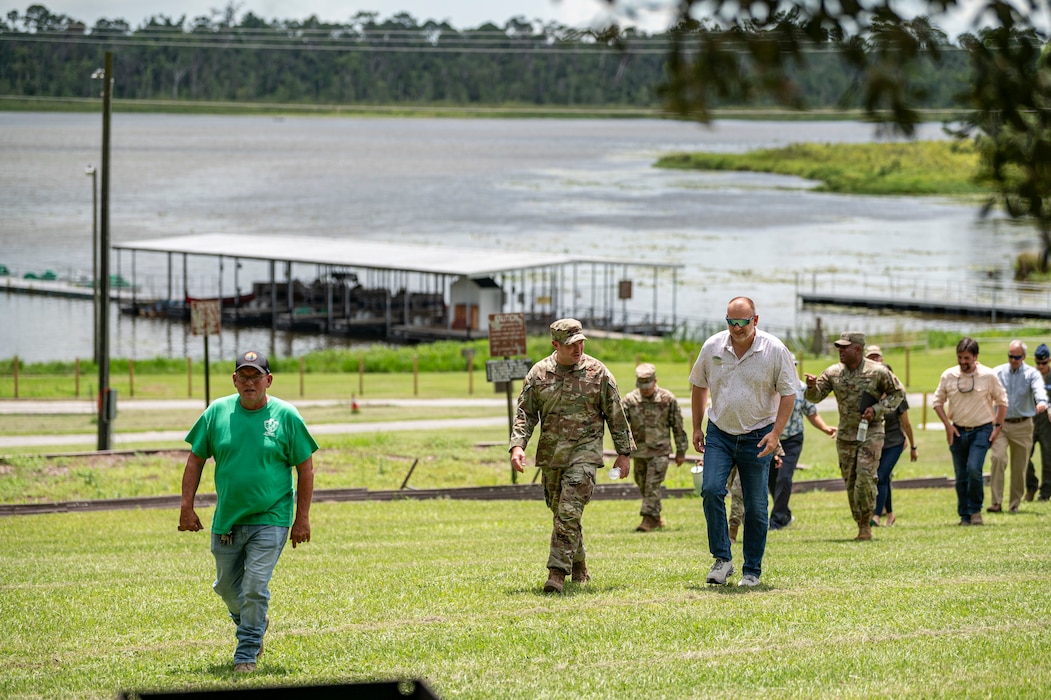 Leadership from Moody Air Force Base, Georgia, receives a tour of Grassy Pond Recreation Area in Lake Park, Georgia, July 18, 2025. During the visit, they reviewed upgrades, including new cabins, repaired docks, and updated recreational areas. (U.S. Air Force photo by Senior Airman Leonid Soubbotine)