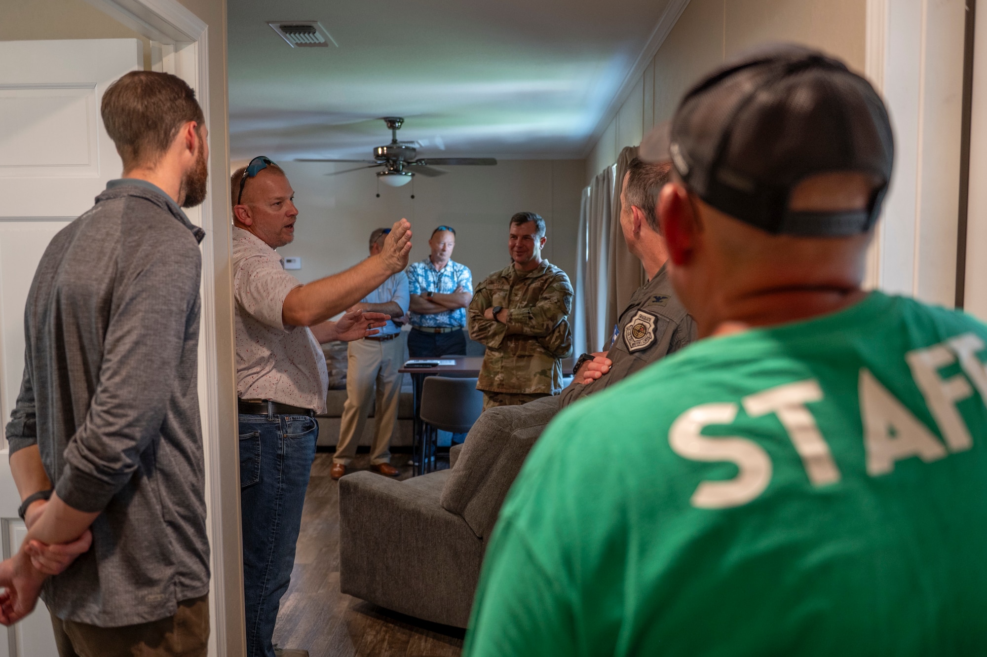 U.S. Air Force Col. Paul Sheets, 23rd Wing commander, third from right, and Col. Sean Hall, 23rd Wing incoming commander, second from right, tour one of the Grassy Pond Recreation Area cabins in Lake Park, Georgia, July 18, 2025. The tour covered recent improvements, such as renovated pavilions, boat additions, and enhanced lodging. (U.S. Air Force photo by Senior Airman Leonid Soubbotine)