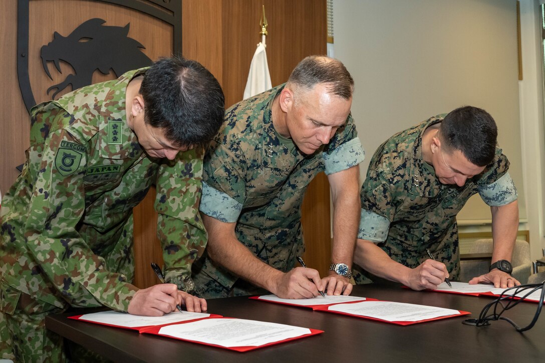 From left, LTG Hiroe Jiro, Commanding General of Training-Evaluation, Education, Research and Development Command (TERCOM), Japan Ground Self-Defense Force, U.S. Marine Corps Lt. Gen. Eric Austin, Deputy Commandant of Combat Development and Integration (CD&I), and Lt. Gen. Benjamin Watson, Commanding General of Training and Education Command (TECOM), signed copies of the Terms of Reference (TOR), defining the framework for future exchanges between TERCOM, CD&I, and TECOM agreeing to further deepen their relationship moving forward.



“Our talks this week are a tremendous opportunity and responsibility to discuss how we best complement each other and to put these ideas into action,” said Austin.



"The discussions this week are an important opportunity for us to continue to strengthen our partnership for the future," said Hiroe. "It is paramount for peace and security in East Asia."



(U.S. Marine Corps photo by Connor Taggart)