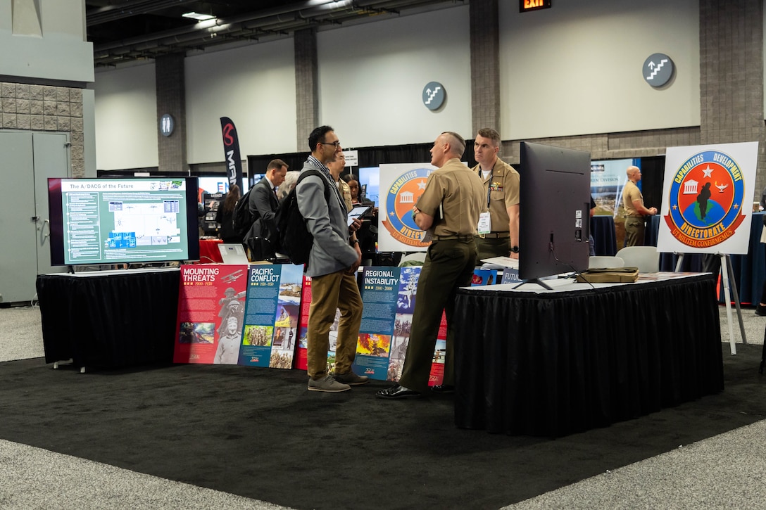Members of the Capabilities Developemet Directorate (CDD), man CDD's booth during Modern Day Marine at the Walter E. Washington Convention Center, Washington D.C., April 29th, 2025. Modern Day Marine is a military exposition exclusively organized for the Marine Corps to showcase the newest technology and warfighting innovations from amphibious assault vehicles to drones and more. (U.S. Marine Corps photo by Connor Taggart)