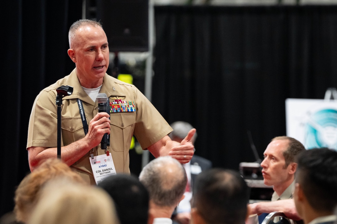 U.S. Marine Corps Col. Daniel Wittnam, Combat Development and Integration, answers a question during Modern Day Marine at the Walter E. Washington Convention Center, Washington D.C., April 30th, 2025. Modern Day Marine is a military exposition exclusively organized for the Marine Corps to showcase the newest technology and warfighting innovations from amphibious assault vehicles to drones and more. (U.S. Marine Corps photo by Connor Taggart)