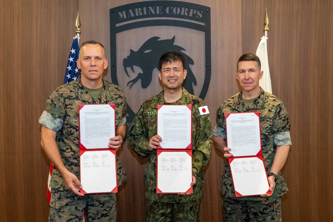 From left, U.S. Marine Corps Lt. Gen. Eric Austin, Deputy Commandant of Combat Development and Integration (CD&I), LTG Hiroe Jiro, Commanding General of Training-Evaluation, Education, Research and Development Command (TERCOM), Japan Ground Self-Defense Force, and U.S. Marine Corps Lt. Gen. Benjamin Watson, Commanding General of Training and Education Command (TECOM), hold signed copies of the Terms of Reference (TOR), defining the framework for future exchanges between TERCOM, CD&I, and TECOM agreeing to further deepen their relationship moving forward.



“Our talks this week are a tremendous opportunity and responsibility to discuss how we best complement each other and to put these ideas into action,” said Austin.



"The discussions this week are an important opportunity for us to continue to strengthen our partnership for the future," said Hiroe. "It is paramount for peace and security in East Asia."



(U.S. Marine Corps photo by Connor Taggart)