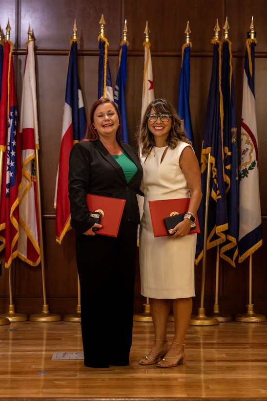 Lauren Yaw, left, muster program manager, Marine Corps Individual Support Activity, Marine Forces Reserve (MARFORRES), and Debbie Wanko, right, deputy assistant chief of staff G-8, MARFORRES, pose for a photo after the Marine Forces Reserve 2024 Civilian of the Year awards at Marine Corps Support Facility, New Orleans, July 23, 2025. U.S. Marine Corps Civilian of the Year Award honors civilian Marines whose outstanding service and dedication have made a lasting impact on the mission of the United States Marine Corps. (U.S. Marine Corps Photo by Lance Cpl. Edward Spears)