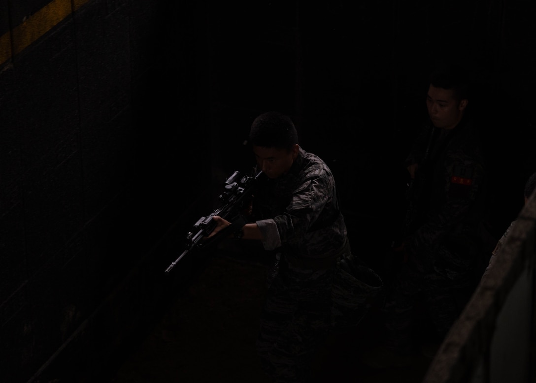 A Republic of Korea Marine with 1st Marine Division, ROK clears a hallway during military operations in urban terrain training during the Korean Marine Exercise Program 25.2 in Pohang, South Korea, July 17, 2025. KMEP is conducted regularly between the ROK and U.S. Marine Corps to increase their combined capabilities through realistic training geared towards deterring threats and maintaining peace in the Indo-Pacific. (U.S. Marine Corps photo by Cpl. Kanoa Thomas)