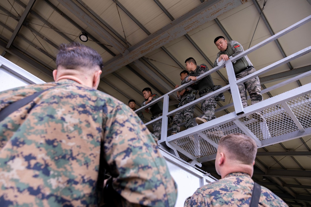 U.S. Marines with 2nd Battalion, 23rd Marines, forward deployed with 4th Marine Regiment, 3d Marine Division as part of the Unit Deployment Program, demonstrate military operations in urban terrain techniques for Republic of Korea Marines with 1st Marine Division, ROK, during the Korean Marine Exercise Program 25.2 in Pohang, South Korea, July 17, 2025. KMEP is conducted regularly between the ROK and U.S. Marine Corps to increase their combined capabilities through realistic training geared towards deterring threats and maintaining peace in the Indo-Pacific. (U.S. Marine Corps photo by Cpl. Kanoa Thomas)