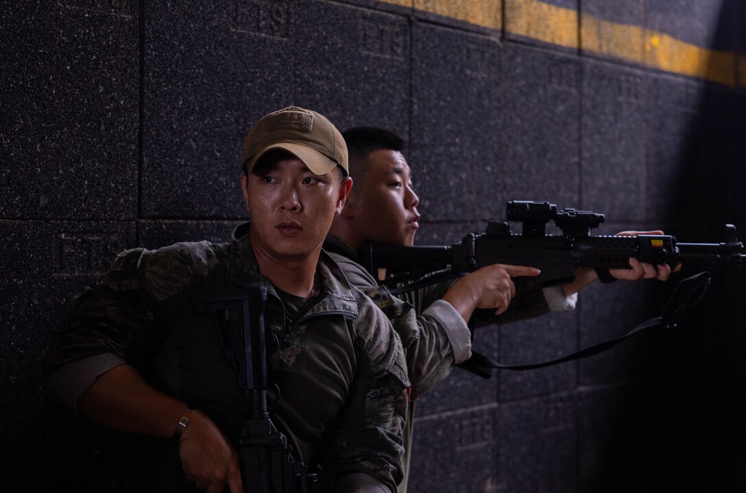 Republic of Korea Marines with 1st Marine Division, ROK provide security during military operations in urban terrain training during the Korean Marine Exercise Program 25.2 at Pohang, South Korea, July 17, 2025. KMEP is conducted regularly between the ROK and U.S. Marine Corps to increase their combined capabilities through realistic training geared towards deterring threats and maintaining peace in the Indo-Pacific. (U.S. Marine Corps photo by Cpl. Kanoa Thomas)