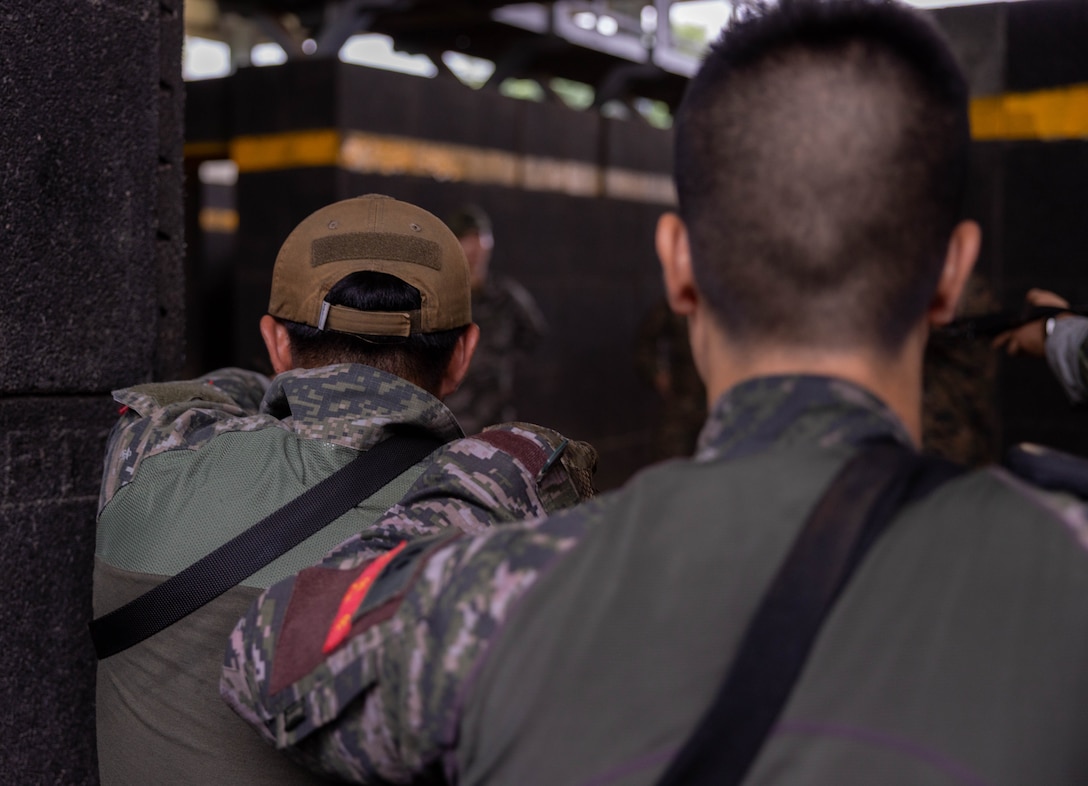 Republic of Korea Marines with 1st Marine Division, ROK provide security during military operations in urban terrain training during the Korean Marine Exercise Program 25.2 in Pohang, South Korea, July 17, 2025. KMEP is conducted regularly between the ROK and U.S. Marine Corps to increase their combined capabilities through realistic training geared towards deterring threats and maintaining peace in the Indo-Pacific. (U.S. Marine Corps photo by Cpl. Kanoa Thomas)