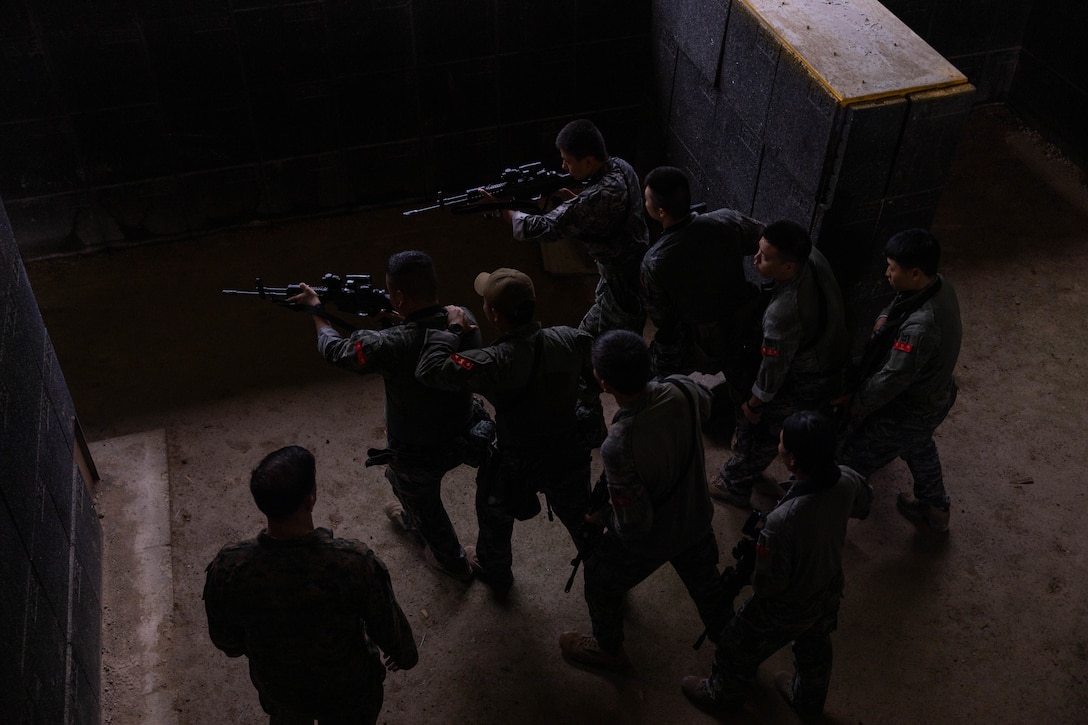 Republic of Korea Marines with 1st Marine Division, ROK prepare to breach a doorway during military operations in urban terrain training during the Korean Marine Exercise Program 25.2 in Pohang, South Korea, July 17, 2025. KMEP is conducted regularly between the ROK and U.S. Marine Corps to increase their combined capabilities through realistic training geared towards deterring threats and maintaining peace in the Indo-Pacific. (U.S. Marine Corps photo by Cpl. Kanoa Thomas)