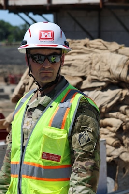 Maj. Kyle Volk working on a construction site