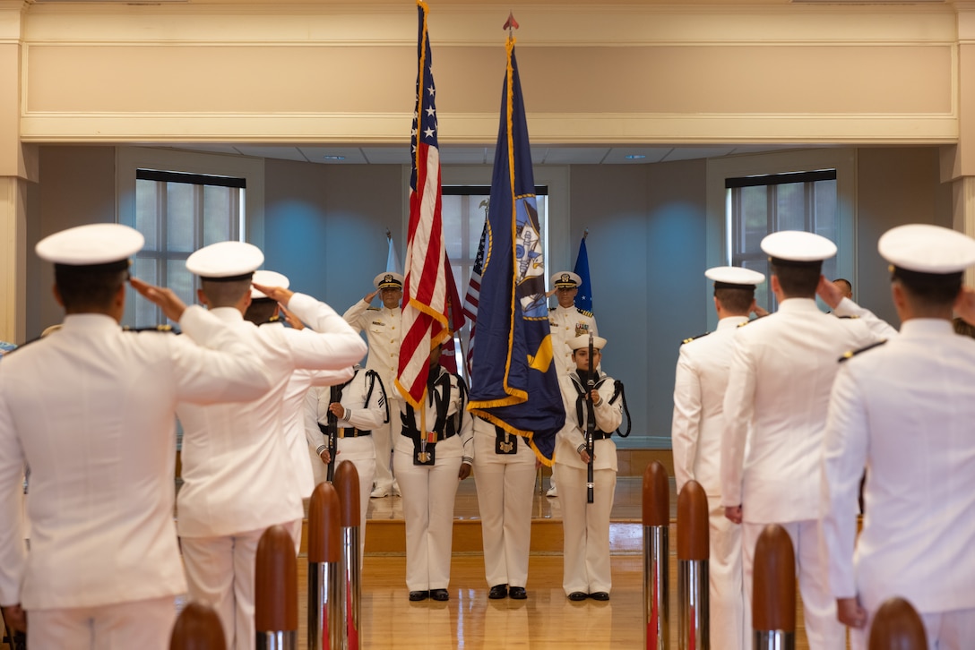 U.S. Navy Sailors with Naval Facilities Engineering Systems Command Atlantic and Officer in Charge of Construction (OICC) Florence, render a salute during the OICC Florence Disestablishment Ceremony at Marine Corps Base Camp Lejeune, North Carolina, July 24, 2025. The ceremony marked the official disestablishment of the unit following five years of reconstruction and military construction efforts in response to Hurricane Florence. (U.S. Marine Corps photo by Lance Cpl. Alyssa J. DeCrane)