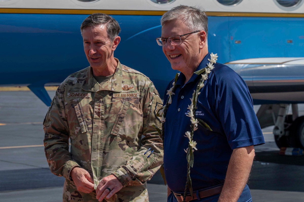 Secretary of the Air Force shakes hand with Gen Kevin Schneider