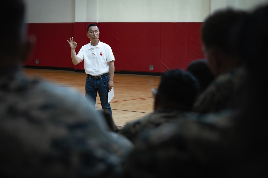 Mr. Pyong-Yol Kim welcomes U.S. Marines with 2nd Battalion, 23rd Marines, forward deployed with 4th Marine Regiment, 3d Marine Division as part of the Unit Deployment Program, after they arrive and offload gear during the Korean Marine Exercise Program 25.2 at Camp Mujuk, South Korea, July 16, 2025. KMEP is a semi-annual exercise that provides iterative opportunities for Republic of Korea Marine Corps and U.S. Marine Corps units to train together, improving their combined capabilities to deter threats and maintain peace on the Korean Peninsula. (U.S. Marine Corps photo by Lance Cpl. Van Hoang)