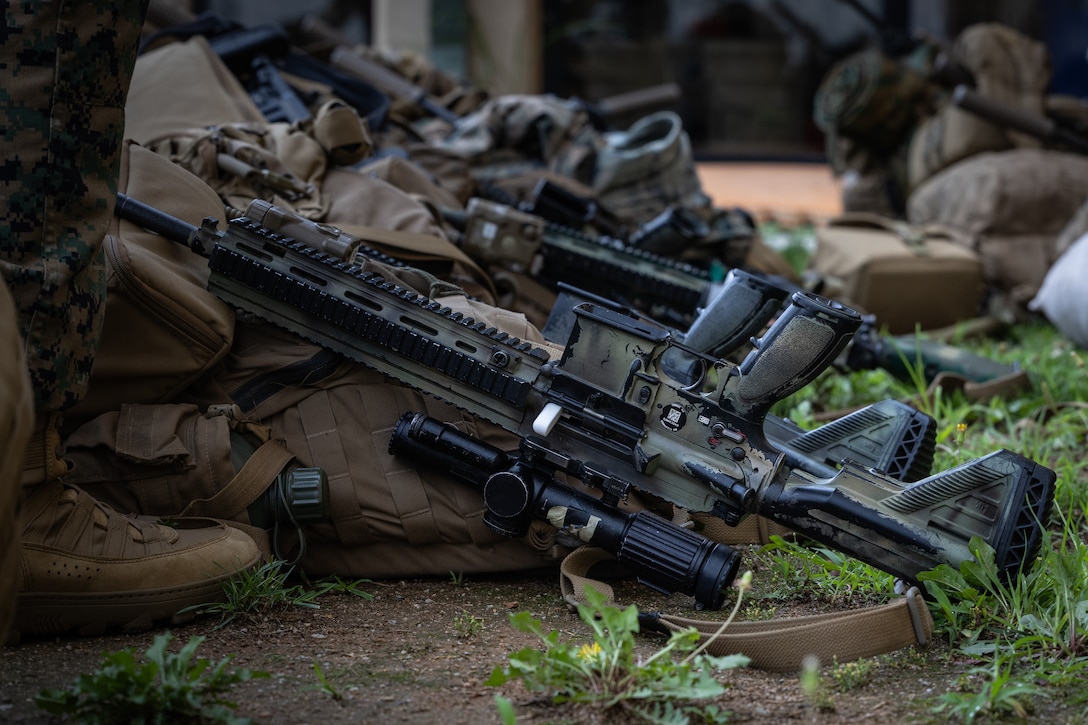 U.S. Marines with 2nd Battalion, 23rd Marines, forward deployed with 4th Marine Regiment, 3d Marine Division as part of the Unit Deployment Program, offload and stage gear upon arriving for the Korean Marine Exercise Program 25.2 at Camp Mujuk, South Korea, July 16, 2025. KMEP is a semi-annual exercise that provides iterative opportunities for Republic of Korea Marine Corps and U.S. Marine Corps units to train together, improving their combined capabilities to deter threats and maintain peace on the Korean Peninsula. (U.S. Marine Corps photo by Lance Cpl. Van Hoang)