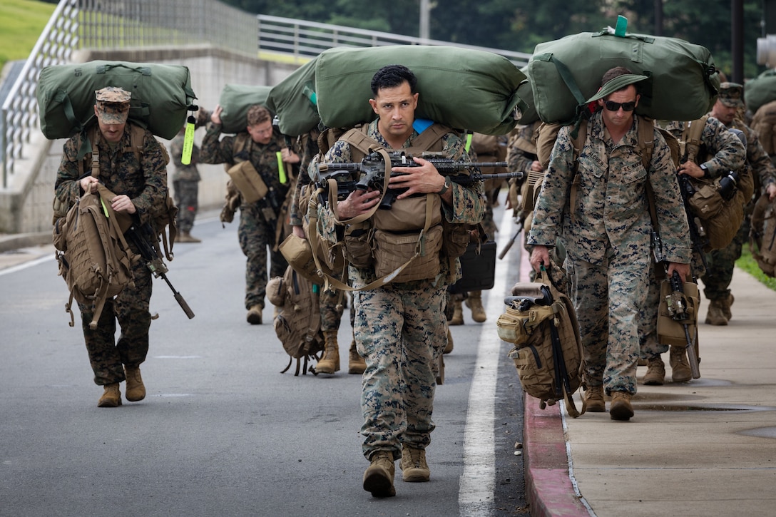 U.S. Marines with 2nd Battalion, 23rd Marines, forward deployed with 4th Marine Regiment, 3d Marine Division as part of the Unit Deployment Program, offload and stage gear upon arriving for the Korean Marine Exercise Program 25.2 at Camp Mujuk, South Korea, July 16, 2025. KMEP is a semi-annual exercise that provides iterative opportunities for Republic of Korea Marine Corps and U.S. Marine Corps units to train together, improving their combined capabilities to deter threats and maintain peace on the Korean Peninsula. (U.S. Marine Corps photo by Lance Cpl. Van Hoang)