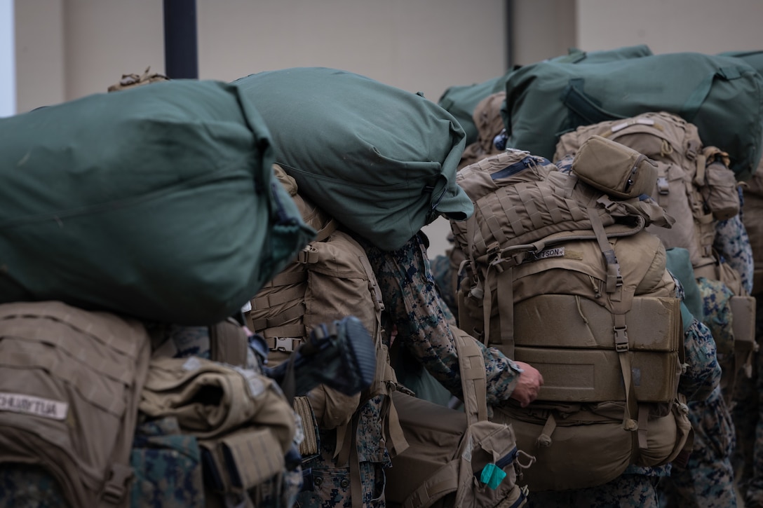 U.S. Marines with 2nd Battalion, 23rd Marines, forward deployed with 4th Marine Regiment, 3d Marine Division as part of the Unit Deployment Program, offload and stage gear upon arriving for the Korean Marine Exercise Program 25.2 at Camp Mujuk, South Korea, July 16, 2025. KMEP is a semi-annual exercise that provides iterative opportunities for Republic of Korea Marine Corps and U.S. Marine Corps units to train together, improving their combined capabilities to deter threats and maintain peace on the Korean Peninsula. (U.S. Marine Corps photo by Lance Cpl. Van Hoang)