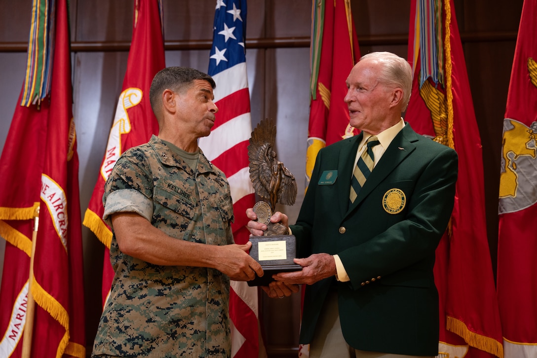U.S. Marine Corps Maj. Gen. John Kelliher III (middle), commanding general of 4th Marine Aircraft Wing (4th MAW), stands with 4th MAW commanding officers during the awards presentation of the Admiral James S. Russell Naval Aviation Flight Safety Award for 2024 at Marine Corps Support Facility, New Orleans, Louisiana, July 24, 2025. The award recognizes the safety and mishap prevention practices that is cultured within military units while still effectively conducting flight operations. (U.S. Marine Corps photo by Cpl. Ujian Gosun)