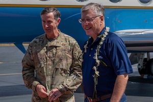 Secretary of the Air Force shakes hand with Gen Kevin Schneider