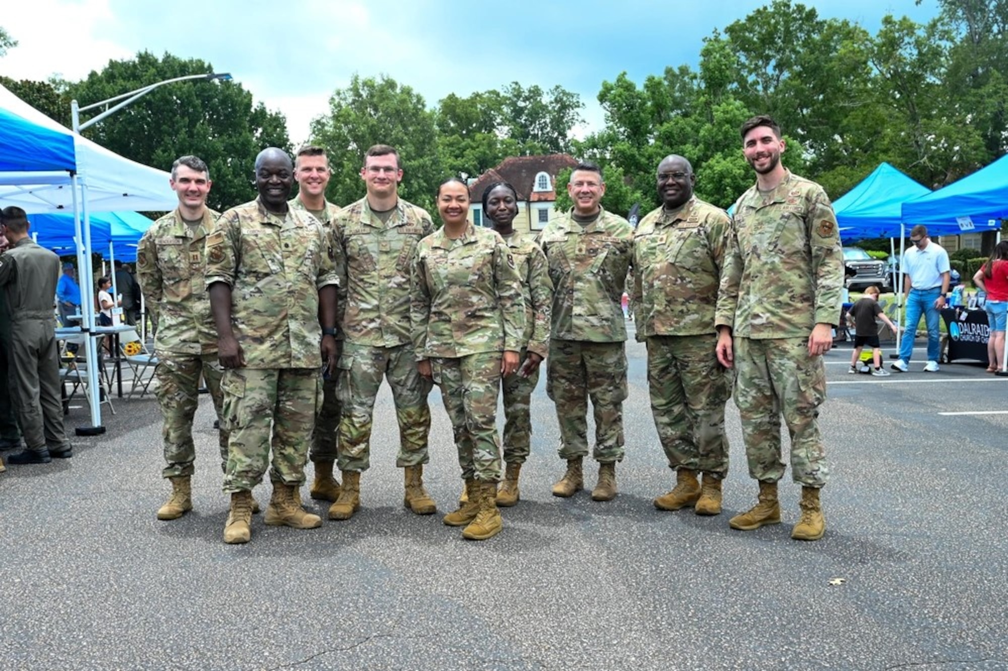 42d Air Base Wing Commander Col. Shamekia Toliver poses with personnel from the 42d ABW Chapel at Maxwell Air Force Base, Ala. July 24, 2025. Faith leaders from across the River Region joined together at Maxwell for a day of dialogue, food, and fellowship to strengthen community partnerships and elevate the quality-of-life efforts for Team Maxwell. (U.S. Air Force photo by Senior Airman Tanner Doerr)