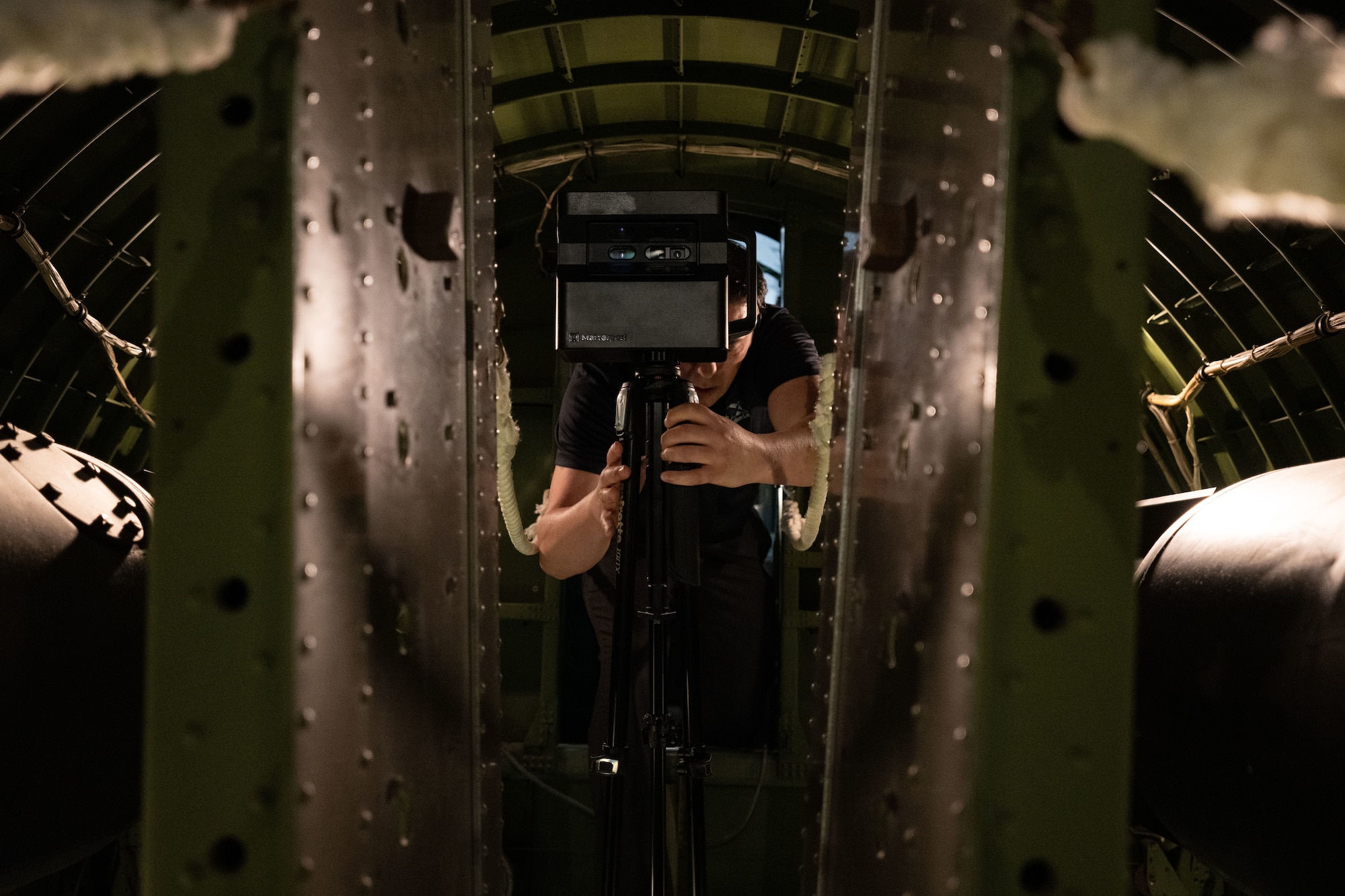 Earl Bagwell, 316th Wing SparkX Cell Innovation and Idea Center innovation officer, sets up a Matterport scanner inside a historic B-17G Flying Fortress in the Air Mobility Command Museum at Dover Air Force Base, Del., June 4, 2025.