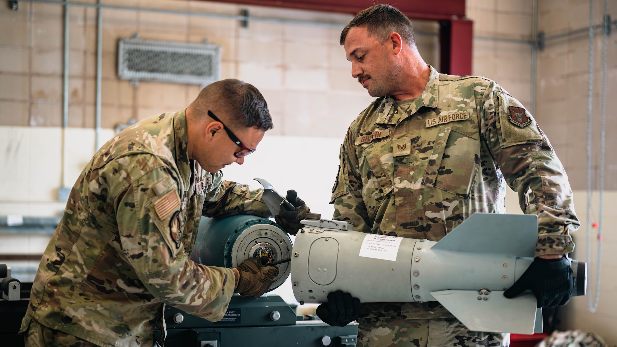 Airmen build munitions